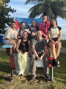 UConn students sitting in oversized chair